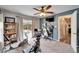 Multipurpose space features an exercise area, desk setup, and backyard pool view at 7402 Gunstock Dr, Lakeland, FL 33809