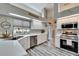 Well-lit kitchen with white cabinets and stainless steel appliances at 7402 Gunstock Dr, Lakeland, FL 33809