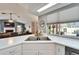 Bright kitchen featuring a large window with a view to the outside at 7402 Gunstock Dr, Lakeland, FL 33809