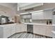 Spacious white kitchen featuring modern stainless steel appliances and fixtures at 7402 Gunstock Dr, Lakeland, FL 33809