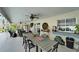 Spacious covered patio with outdoor dining and a ceiling fan for comfortable entertaining at 7402 Gunstock Dr, Lakeland, FL 33809