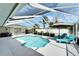Beautiful pool and patio area with screened enclosure, perfect for outdoor enjoyment at 7402 Gunstock Dr, Lakeland, FL 33809