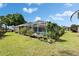 A covered pool with a garden view and lots of vegetation at 7402 Gunstock Dr, Lakeland, FL 33809