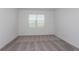 Cozy bedroom with plush carpet and large windows that allow for ample natural light at 8953 Wildlight Trl, Wildwood, FL 34785
