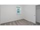 Bedroom with carpeting, a window, a closet, and neutral walls at 8953 Wildlight Trl, Wildwood, FL 34785