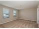 Bright bedroom featuring plush carpeting, two windows, and a neutral paint scheme at 1768 Frogmore Ave, Haines City, FL 33844