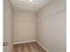 Walk-in closet featuring wire shelving and a neutral paint scheme at 1768 Frogmore Ave, Haines City, FL 33844