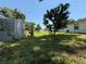 Exterior shot of a backyard with a shed, some foliage, and the side of the house at 231 Connie Lee Ct, Lakeland, FL 33809