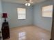 Bedroom featuring tile flooring, neutral paint, natural light from windows, and a ceiling fan at 231 Connie Lee Ct, Lakeland, FL 33809