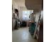 Utility room with storage shelves, laundry appliances, and natural lighting at 231 Connie Lee Ct, Lakeland, FL 33809