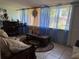 Inviting sun room with a wet bar, lounge seating, and bright natural lighting at 231 Connie Lee Ct, Lakeland, FL 33809