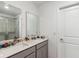 Bathroom featuring double sinks with stone countertops and a glass-enclosed shower at 356 Loch Ct, Davenport, FL 33837