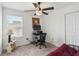 Bedroom with desk, chair, lamp, ceiling fan, and closet at 356 Loch Ct, Davenport, FL 33837
