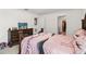 Cozy bedroom with a decorative dresser and a view into the walk-in closet at 356 Loch Ct, Davenport, FL 33837