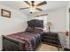 Comfortable bedroom featuring a decorative bed, bedside table and ceiling fan at 356 Loch Ct, Davenport, FL 33837