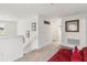 Upstairs hallway with neutral carpet and walls, enhanced with recessed lighting and framed artwork at 356 Loch Ct, Davenport, FL 33837