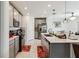 Modern kitchen featuring stainless steel appliances, granite countertops, and ample storage at 356 Loch Ct, Davenport, FL 33837