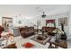 Open-concept living room with updated lighting, tile floors, and comfortable seating arrangement at 356 Loch Ct, Davenport, FL 33837