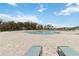 Relaxing community pool featuring ample lounge seating and a splash pad area for all ages at 356 Loch Ct, Davenport, FL 33837