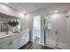 Modern bathroom with double vanity, sleek fixtures, and walk-in glass shower at 1022 Brimstone Cir, Winter Haven, FL 33884