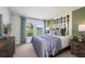 Stylish bedroom with paddle decor, a comfortable bed and exterior view at 1022 Brimstone Cir, Winter Haven, FL 33884