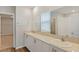 Bathroom features double sinks, quartz counters, tile floors and a shower for a luxurious experience at 1616 Ellesmere Ave, Haines City, FL 33844