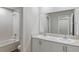 Bathroom featuring double sinks and a bathtub shower combo at 1616 Ellesmere Ave, Haines City, FL 33844