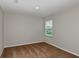 Bedroom featuring neutral walls, carpeting, and a window with blinds at 1616 Ellesmere Ave, Haines City, FL 33844