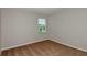 Bedroom featuring neutral walls, carpeting, and a window with blinds at 1616 Ellesmere Ave, Haines City, FL 33844