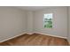 Bedroom featuring neutral walls, carpeting, and a window with blinds at 1616 Ellesmere Ave, Haines City, FL 33844