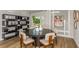 Elegant dining room featuring a stylish table, modern light fixture, and ample seating at 2004 Marigold Aly, Winter Haven, FL 33884