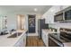 Well-equipped kitchen with stainless steel appliances and spacious countertops at 2004 Marigold Aly, Winter Haven, FL 33884