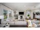 Comfortable living room with ample seating, stylish decor, and abundant natural light at 2004 Marigold Aly, Winter Haven, FL 33884