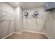 Spacious walk-in closet with ample shelving and rods for organized storage at 2004 Marigold Aly, Winter Haven, FL 33884
