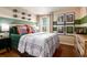 Bedroom with sports decor, large bed, neutral walls with green accent, and natural lighting at 2212 Canyon Oak Dr, Davenport, FL 33837