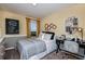 Neutral bedroom with writing desk, single bed, and learning-themed decor, promoting a scholarly atmosphere at 2212 Canyon Oak Dr, Davenport, FL 33837
