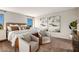 Spacious main bedroom with neutral tones and decor, including a comfy seating area at 2212 Canyon Oak Dr, Davenport, FL 33837