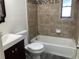 Bathroom featuring tile walls and a modern vanity and tub at 930 29Th Nw St, Winter Haven, FL 33881