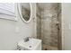 Updated bathroom with tiled shower and a stylish sink at 930 29Th Nw St, Winter Haven, FL 33881