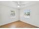 Bright bedroom with wood floors and a ceiling fan at 930 29Th Nw St, Winter Haven, FL 33881