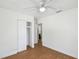 Bright bedroom with wood floors and a view to the bathroom at 930 29Th Nw St, Winter Haven, FL 33881