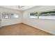 This bedroom features wood floors and two windows for plenty of natural light at 930 29Th Nw St, Winter Haven, FL 33881