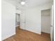 Bright bedroom features wood floors, closet, and multiple doors at 930 29Th Nw St, Winter Haven, FL 33881