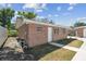 Detached structure with brick facade, white trim, and grassy yard at 930 29Th Nw St, Winter Haven, FL 33881
