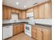 Well-lit kitchen with wood cabinets, modern appliances, and ample counter space at 930 29Th Nw St, Winter Haven, FL 33881