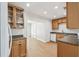 Bright kitchen with wood cabinets, recessed lighting, and neutral countertops at 930 29Th Nw St, Winter Haven, FL 33881