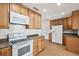 Bright kitchen featuring modern appliances, ample cabinet space, and durable countertops at 930 29Th Nw St, Winter Haven, FL 33881