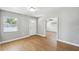 Bright living room featuring wood floors, large windows, and neutral paint at 930 29Th Nw St, Winter Haven, FL 33881