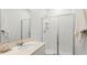 Clean bathroom featuring an oval sink, framed mirror, toilet, and shower with glass doors at 3317 Armstrong Ave, Clermont, FL 34714