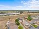 Aerial view of a neighborhood with single-Gathering homes and a clear blue sky at 438 Cotswold Cir, Davenport, FL 33837